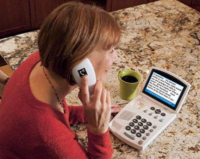 One of the types of phones for people with hearing aids is a captioned telephone.
